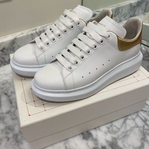 Alexander McQueen oversized white and gold sneakers